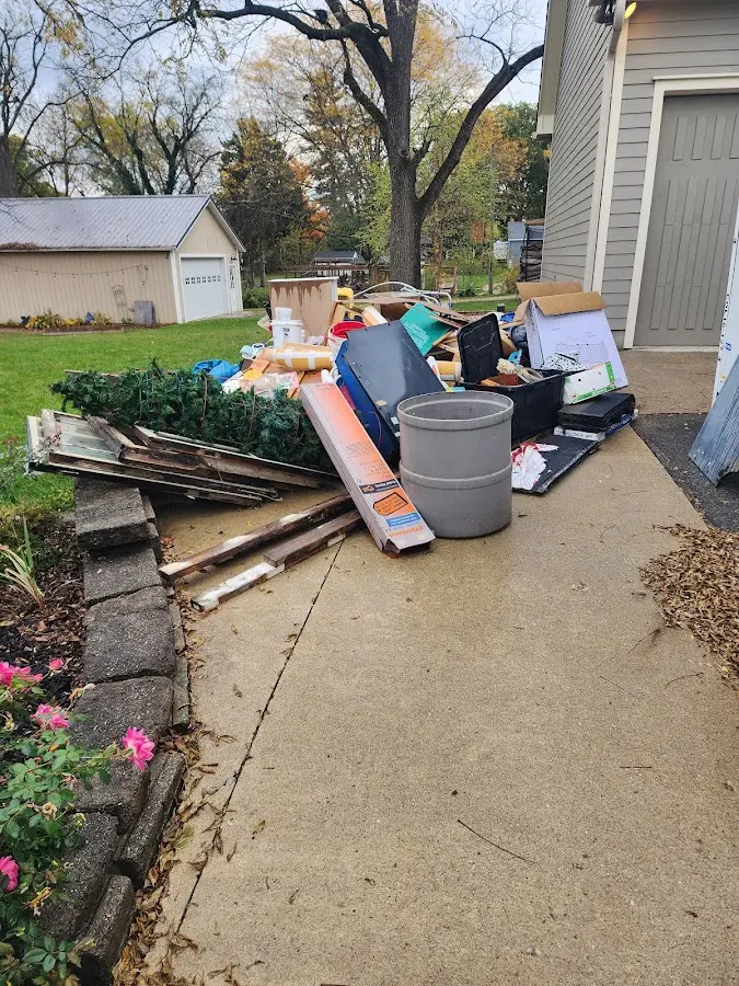 Dumpster being loaded with debris for Residential Dumpster Rental in Prosper